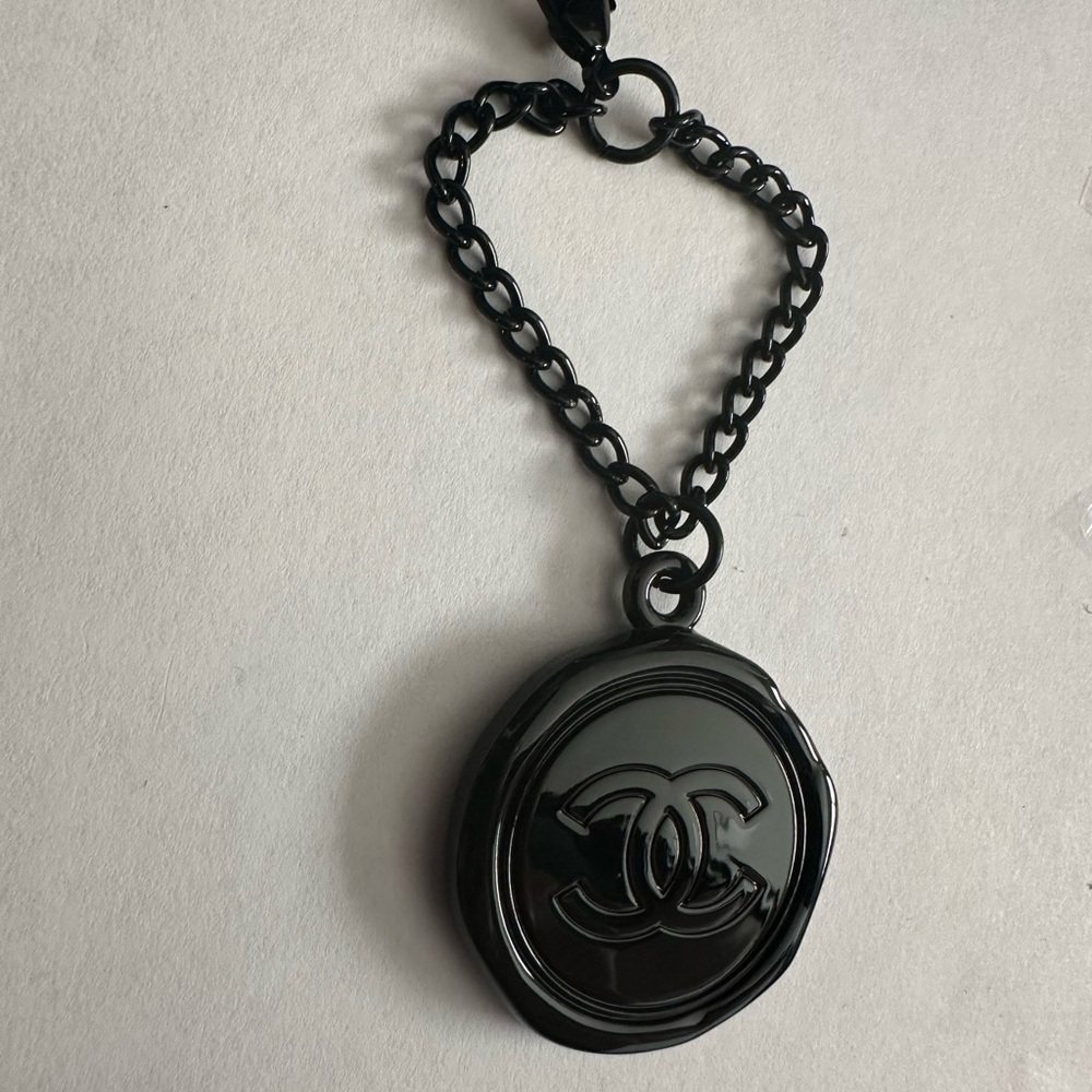CHANEL Glossy Black Logo bag charm